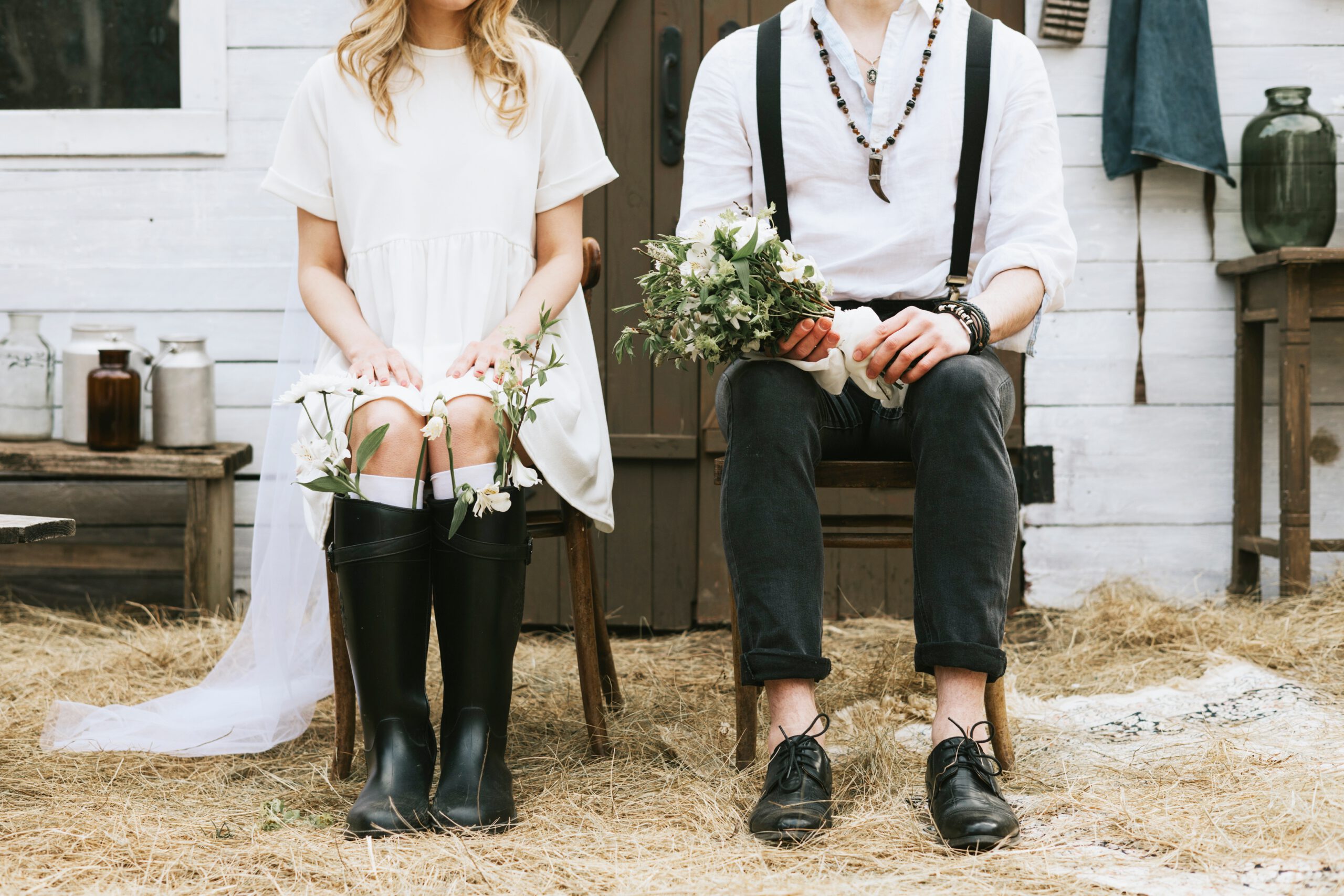 Flowers in wedding boots beside a bridal bouquet