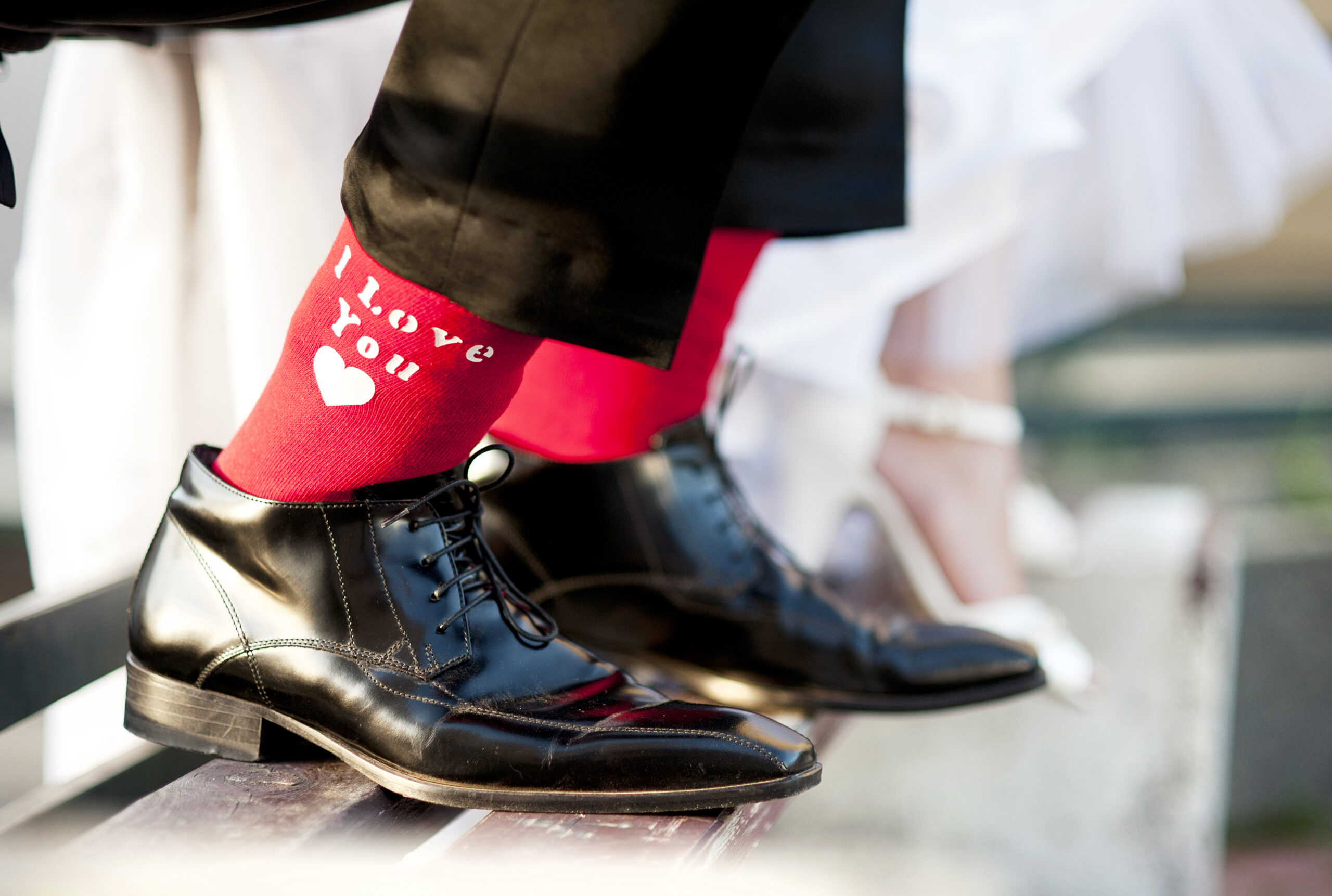 A couple's feet close together — love and commitment